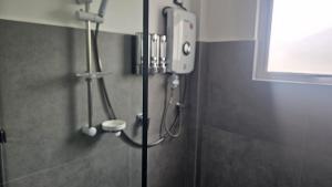a shower in a bathroom with a shower at Blackpool Complex - Lavender in Trincomalee +10 photos