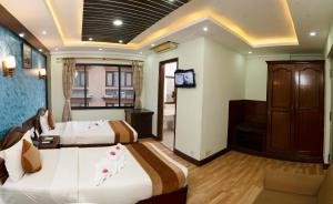 Ένα ή περισσότερα κρεβάτια σε δωμάτιο στο Samsara Boutique Hotel