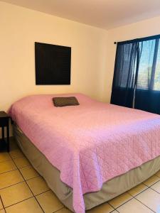 Ένα ή περισσότερα κρεβάτια σε δωμάτιο στο Departamento en playas de Tijuana