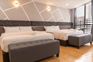 Postel nebo postele na pokoji v ubytování Sunrisestay
