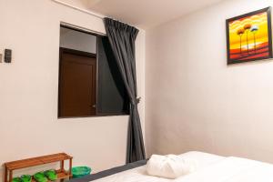 Postel nebo postele na pokoji v ubytování Sunrisestay