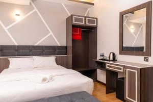 Postel nebo postele na pokoji v ubytování Sunrisestay