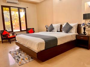 a bedroom with a large bed in a room at The calagute Beach Resort By Shivam Resort 1 km from beach in Candolim