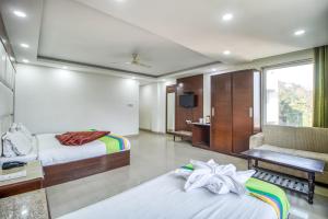 Ένα ή περισσότερα κρεβάτια σε δωμάτιο στο Deep Hotel