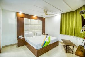 Ένα ή περισσότερα κρεβάτια σε δωμάτιο στο Deep Hotel
