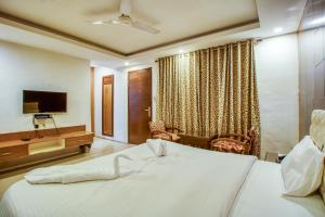 Ένα ή περισσότερα κρεβάτια σε δωμάτιο στο Deep Hotel