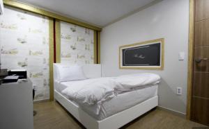 Postel nebo postele na pokoji v ubytování Art motel