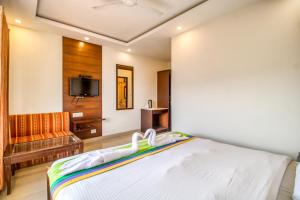 Ένα ή περισσότερα κρεβάτια σε δωμάτιο στο Deep Hotel