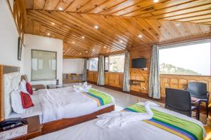 Ένα ή περισσότερα κρεβάτια σε δωμάτιο στο Deep Hotel