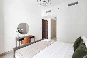 Postel nebo postele na pokoji v ubytování Silkhaus Chic 1BDR at Najmat Near Reem Central Park