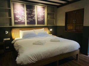 Tali-Yailai Hostel客房内的一张或多张床位