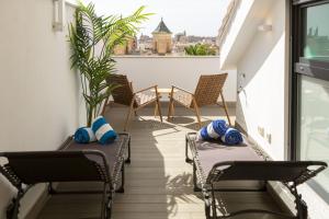 A seating area at Chinchilla Apartment in Malaga by Solaga Holiday Homes