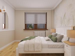 a bedroom with a white bed with a window at Cosy Space Apartment in Tychy