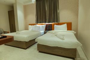 Hotel Aishwarya客房内的一张或多张床位