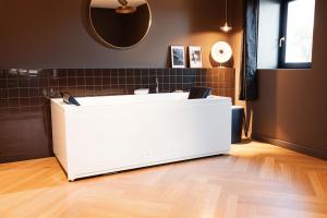a white counter in a room with a mirror at Gite De La Borie in Saint-Ignat +43 photos