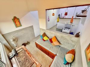 a small room with a bed in a room at Harbor View AC Apartment in Ambalangoda