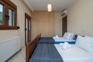 Postel nebo postele na pokoji v ubytování Artemis Oasis Villa with private Pool