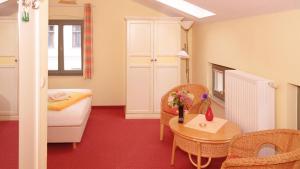 a room with a bed and a table and chairs at Studio VS 14 in Heringsdorf