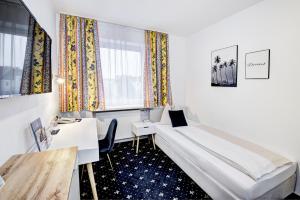 Postel nebo postele na pokoji v ubytování Hotel Bayrischer Hof