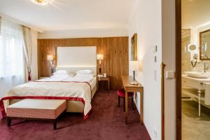 Posteľ alebo postele v izbe v ubytovaní Hotel Stefanie - VIENNA'S OLDEST HOTEL