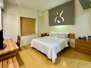 Voodi või voodid majutusasutuse Sparks Life Jakarta, ARTOTEL Curated toas