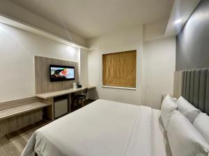 Voodi või voodid majutusasutuse Sparks Life Jakarta, ARTOTEL Curated toas