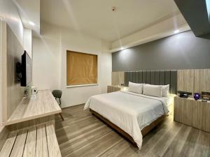 Voodi või voodid majutusasutuse Sparks Life Jakarta, ARTOTEL Curated toas