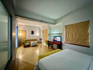 Voodi või voodid majutusasutuse Sparks Life Jakarta, ARTOTEL Curated toas