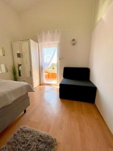 Ένα ή περισσότερα κρεβάτια σε δωμάτιο στο Apartments KANI