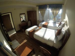 Uma cama ou camas num quarto em Trekkers Home