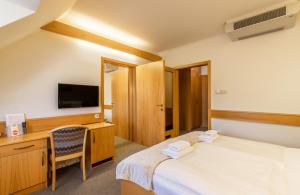 Posteľ alebo postele v izbe v ubytovaní Aqua Hotel Termál