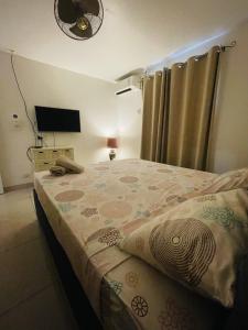 Postel nebo postele na pokoji v ubytování Bula Breeze Lodge