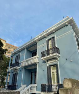 a blue building with balconies on the side of it at Villa Clio, a Luxury Collection in Thessaloniki