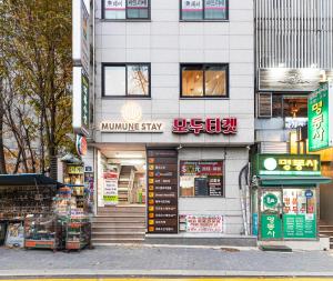a store on a street in an asian city at Mumune Stay in Seoul +32 photos