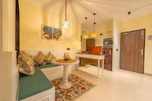 Posezení v ubytování Aloha on the Ganges Ganga View with Infinity Pool 2BHK 408 by Almost Heaven