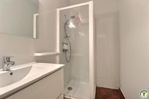 a white bathroom with a shower and a sink at Gîte de Bathernay au Donjon in Bathernay +25 photos