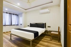 Postel nebo postele na pokoji v ubytování Super Hotel O Dabolim Near Goa International Airport