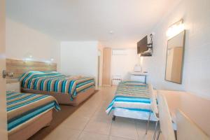 Postel nebo postele na pokoji v ubytování A & A Motel
