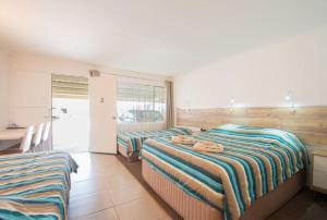 Postel nebo postele na pokoji v ubytování A & A Motel