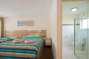 Postel nebo postele na pokoji v ubytování A & A Motel