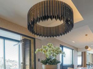 a large chandelier hanging from the ceiling in a room at Aurum 501 and 101 in Cape Town