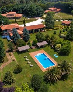 an aerial view of a house with a swimming pool at HolaCamp Camino in O Pino 