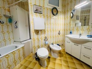 a bathroom with a sink and a toilet and a bath tub at Suite Euforbia Bilo - Sanremo in Sanremo +10 photos