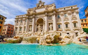 a building with a fountain in front of a building at Magenta Tiburtino in Rome