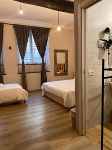 Postel nebo postele na pokoji v ubytování Piccolo Borgo