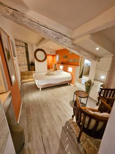 Ένα ή περισσότερα κρεβάτια σε δωμάτιο στο Suites Coupo Santo et Lou peïro