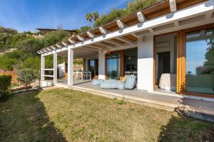 a porch of a house with a view of a yard at Villa LUNA in Oasi dei Due Mari