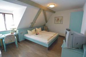 Postel nebo postele na pokoji v ubytování AKZENT Hotel Grüner Baum + 19 fotografií