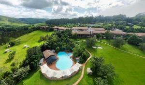 an aerial view of a house with a swimming pool at Drakensberg Sun Resort in Winterton