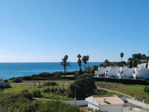 a view of the ocean from a building at 4º5 Edificio Mar - Casas & Papeis in Armação de Pêra